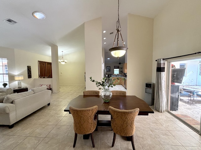 dining area with plenty of natural light, light tile patterned floors, and a notable chandelier