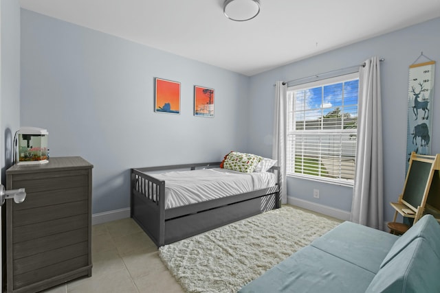 bedroom featuring light tile patterned floors