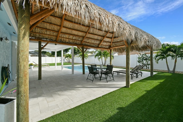 view of patio with a gazebo and a fenced in pool