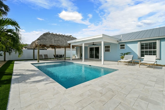 view of pool with a gazebo, a patio, and ceiling fan