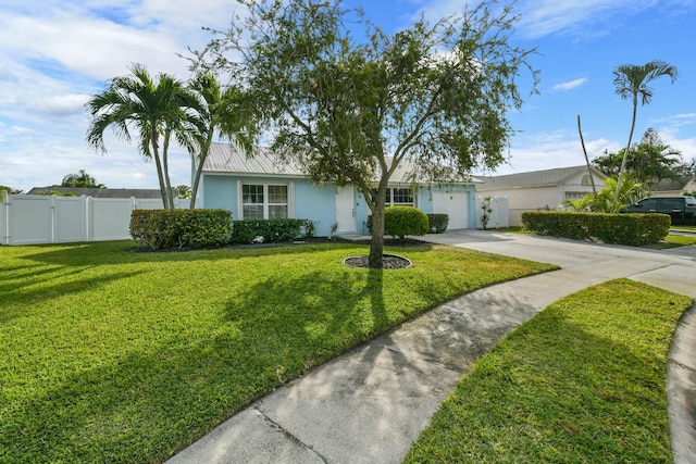 ranch-style home with a garage and a front lawn