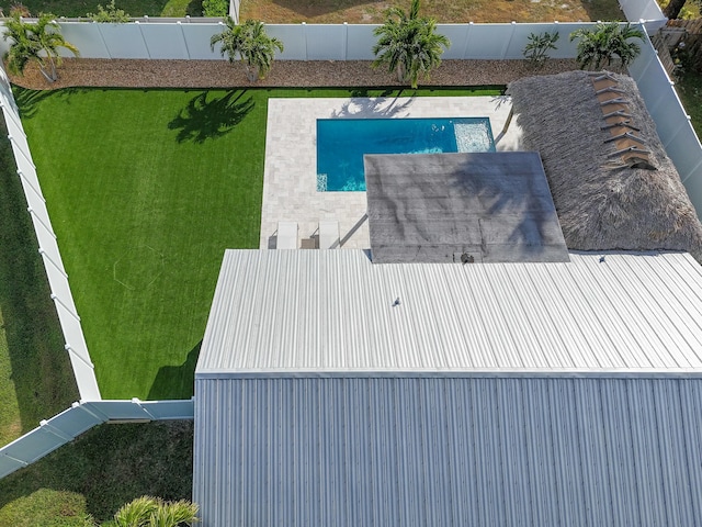 view of pool with a yard and a patio