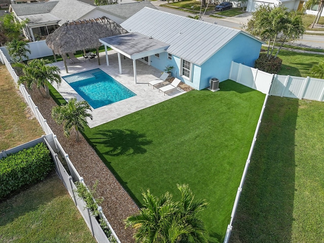 view of swimming pool featuring a gazebo, a patio, cooling unit, and a lawn