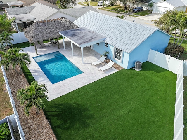 view of pool featuring a gazebo, a yard, a patio, and central air condition unit