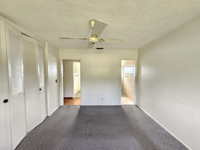 unfurnished bedroom with light colored carpet, connected bathroom, and a closet