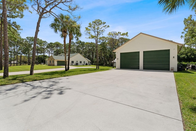 garage featuring a yard