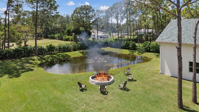 exterior space featuring a water view and a yard