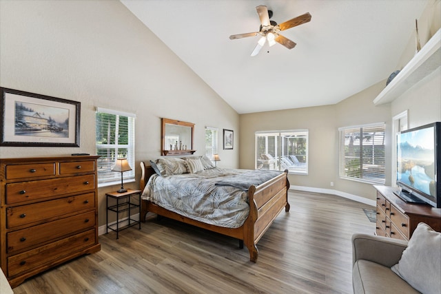 bedroom featuring ceiling fan, high vaulted ceiling, and dark wood-type flooring