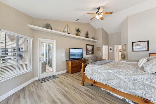 bedroom with access to exterior, light hardwood / wood-style flooring, ceiling fan, and lofted ceiling