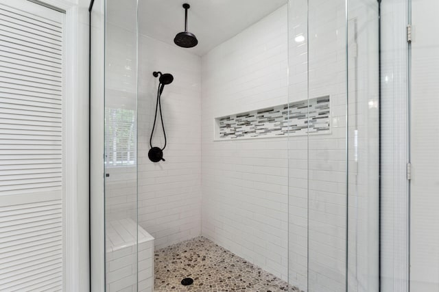 bathroom with a tile shower