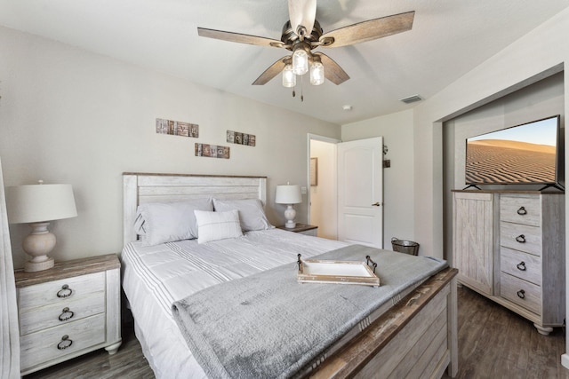 bedroom featuring dark hardwood / wood-style flooring and ceiling fan