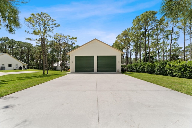 garage with a lawn