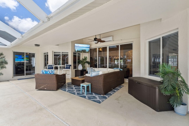 view of patio / terrace with an outdoor living space and ceiling fan