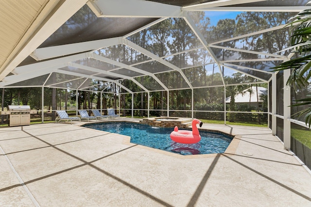 view of swimming pool with a patio area, an in ground hot tub, glass enclosure, and grilling area