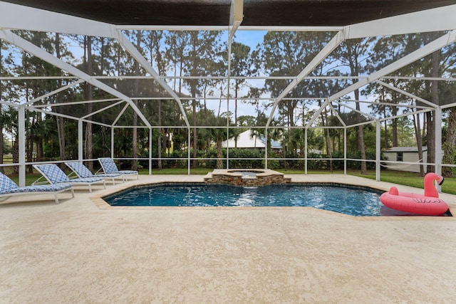 view of swimming pool with a lanai, a patio, and an in ground hot tub