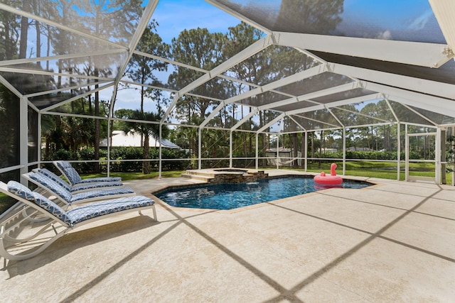 view of pool with glass enclosure, an in ground hot tub, and a patio