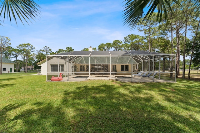 back of house with a patio, a lanai, and a lawn