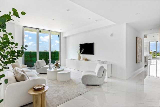 495 E Royal Palm Rd Unit 601, Boca Raton, FL 33432 - living room with a wall of windows, baseboards, and recessed lighting