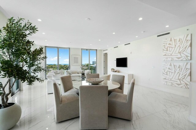 dining area featuring expansive windows