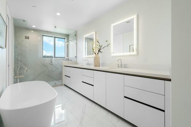 bathroom featuring shower with separate bathtub and vanity