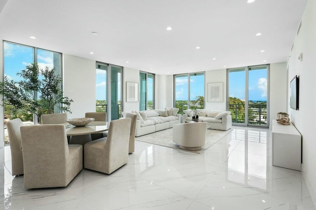 living room featuring plenty of natural light and floor to ceiling windows