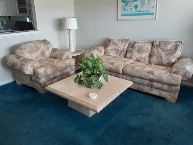 living room with dark carpet and sink