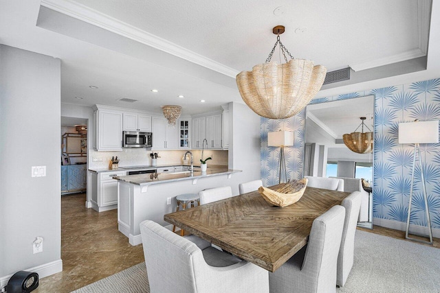 dining area featuring ornamental molding