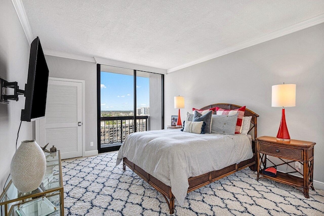 bedroom featuring floor to ceiling windows, access to outside, ornamental molding, a textured ceiling, and light colored carpet