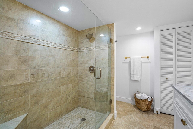 bathroom with a shower with door