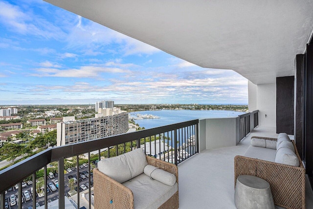 balcony featuring a water view