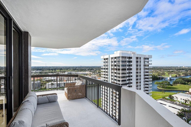 balcony featuring a water view