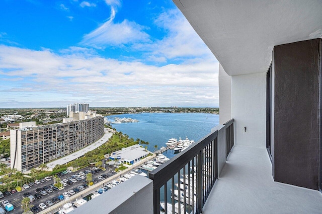 balcony featuring a water view