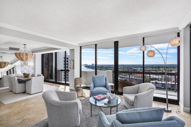 living room with a textured ceiling, a wall of windows, and crown molding