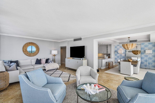 living room featuring a textured ceiling and ornamental molding