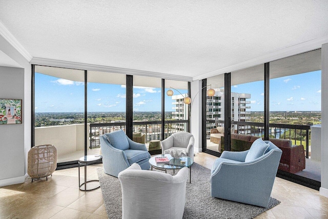 living room featuring a wealth of natural light, a wall of windows, and light tile patterned flooring