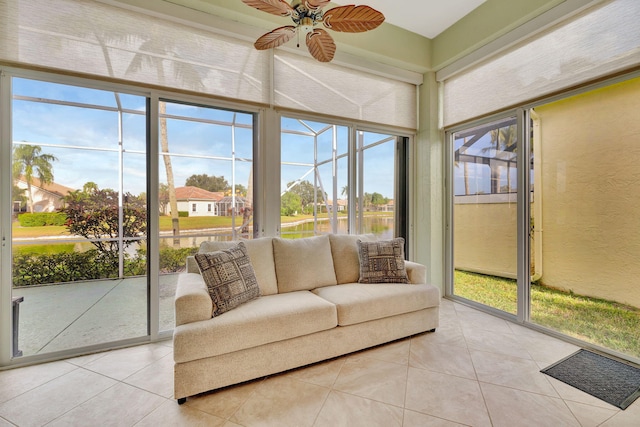 sunroom featuring ceiling fan