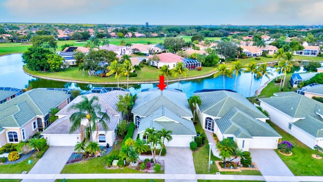 birds eye view of property featuring a water view