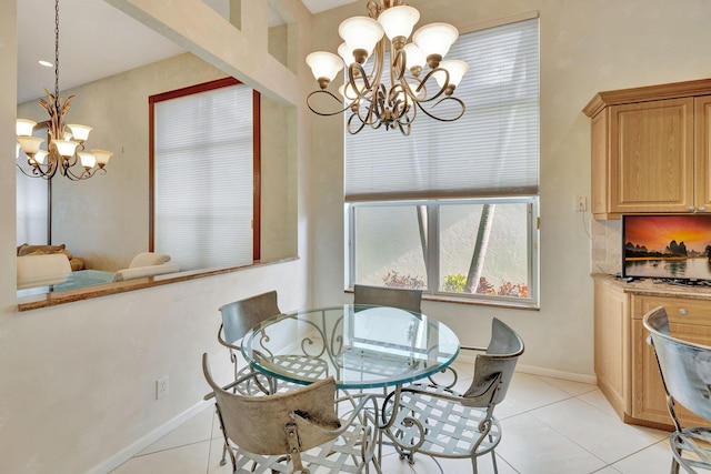 dining area featuring a notable chandelier and light tile patterned floors