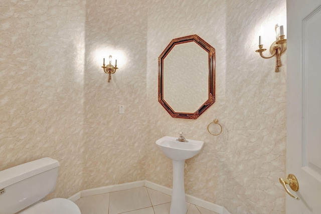 bathroom with tile patterned flooring and toilet