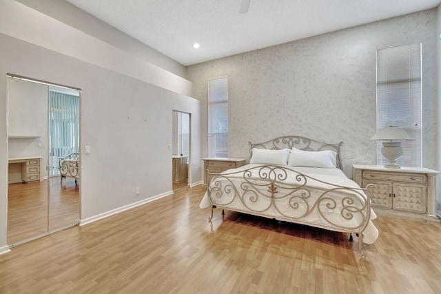 bedroom featuring ceiling fan and light wood-type flooring