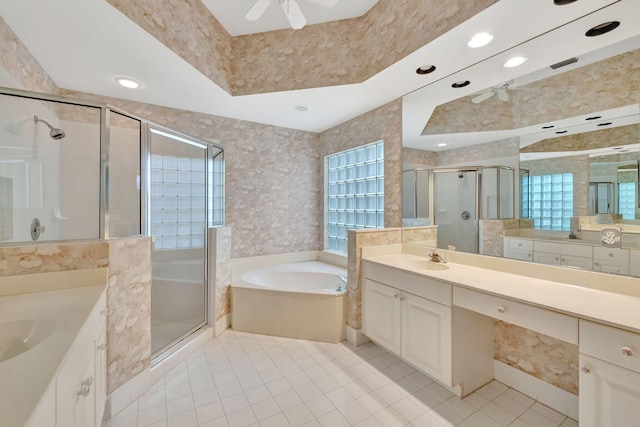 bathroom with tile patterned flooring, vanity, ceiling fan, and plus walk in shower