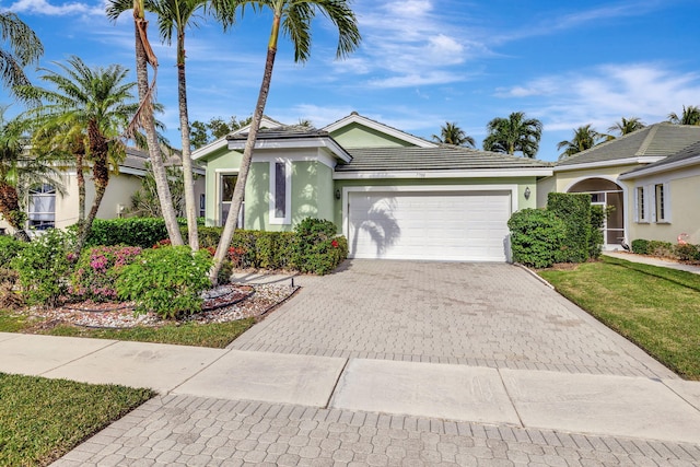 ranch-style house with a front lawn and a garage