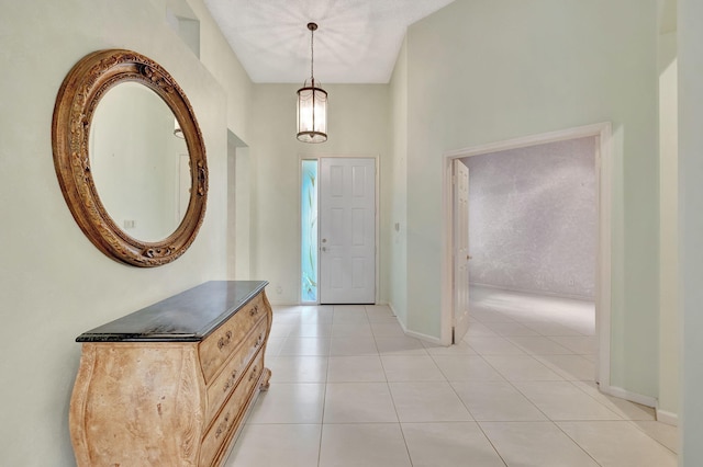 foyer featuring light tile patterned floors