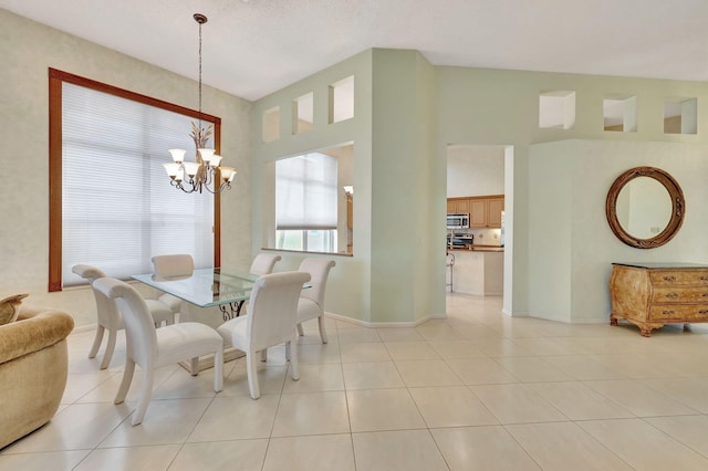 tiled dining area with a notable chandelier