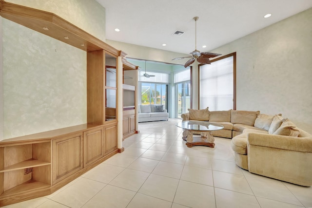 living room featuring ceiling fan and light tile patterned flooring