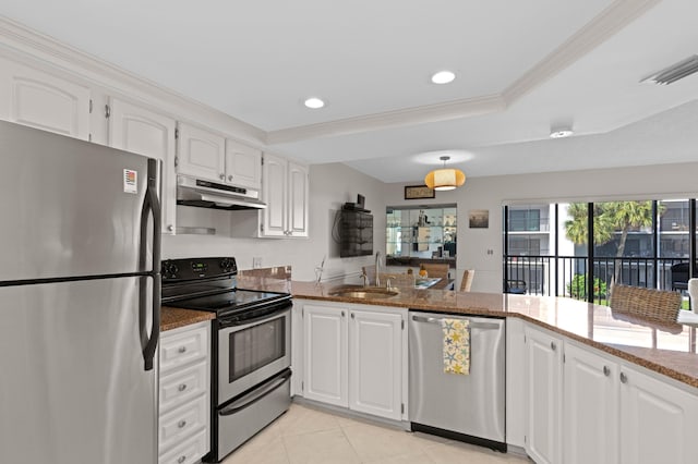 kitchen with white cabinetry, sink, kitchen peninsula, dark stone counters, and appliances with stainless steel finishes