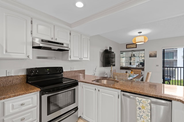 kitchen with white cabinets, stainless steel appliances, and kitchen peninsula