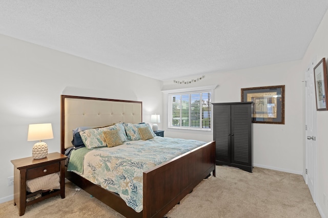 carpeted bedroom with a textured ceiling