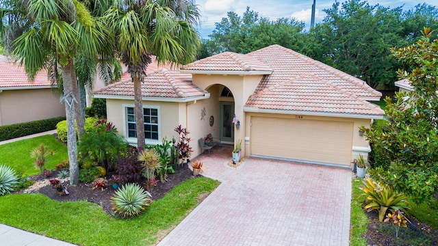 mediterranean / spanish-style home featuring a garage