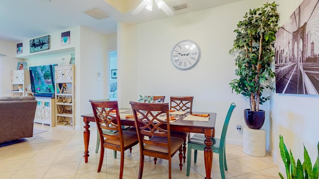 tiled dining area with ceiling fan